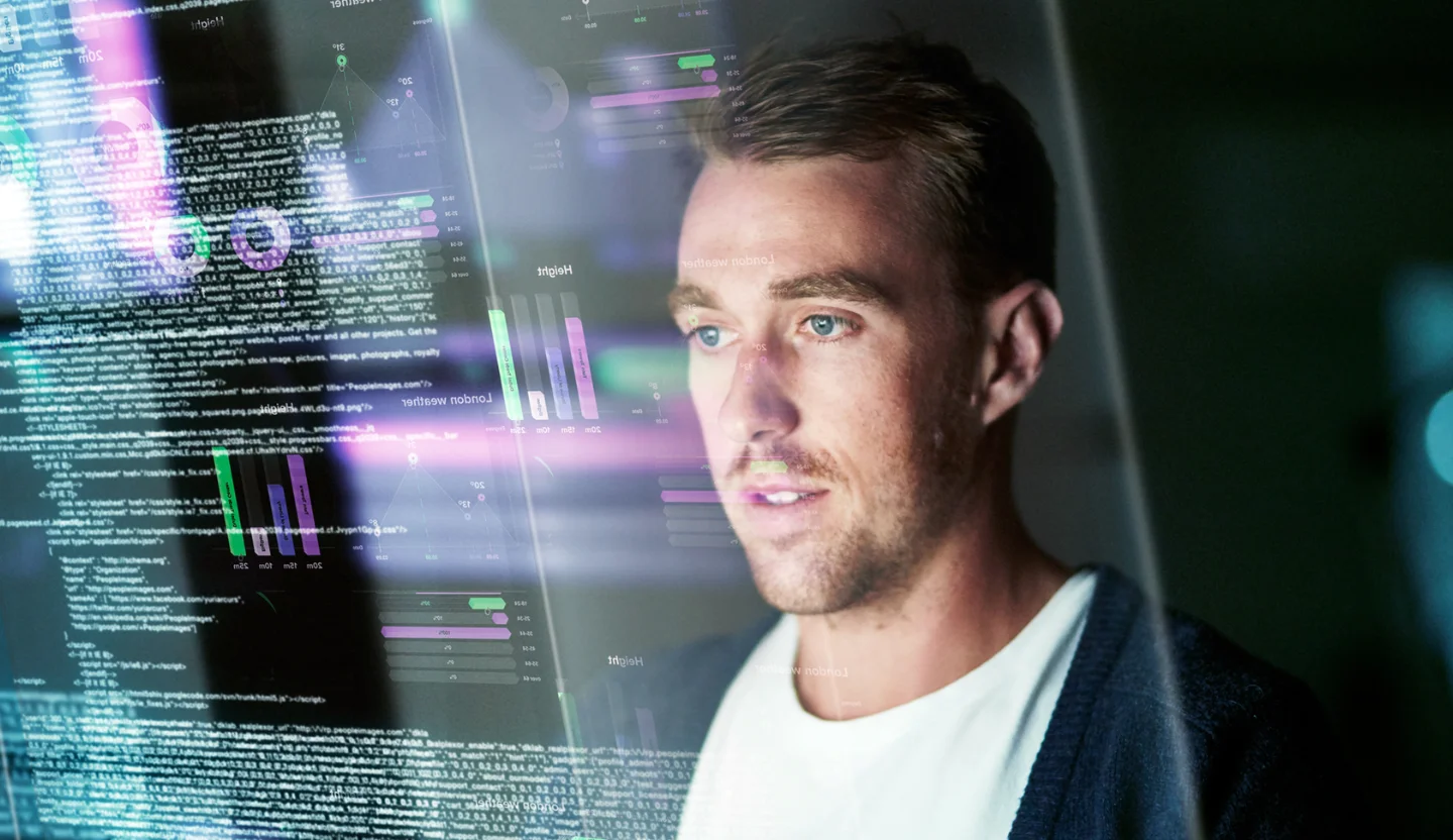 Security analyst viewing code and metrics to scale securely