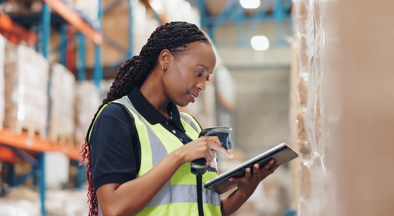 Worker scanning inventory tablet