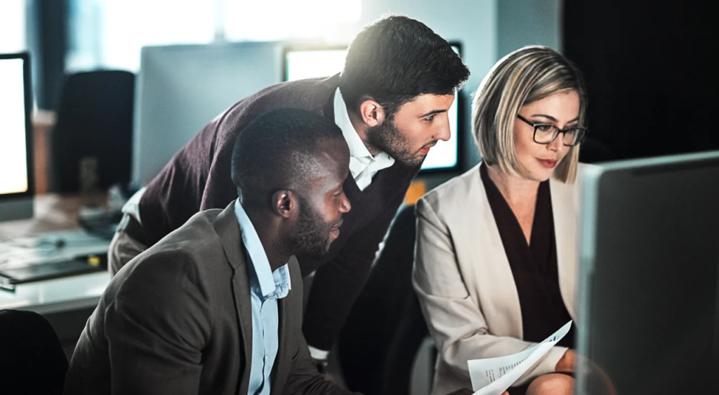 Colleagues analyzing supply metrics